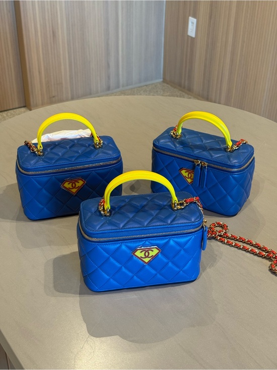 CHANEL Handbags - CHANEL Blue Quilted Crossbody Vanity Bag with Yellow Handle hero/superman